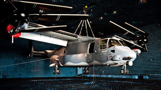 US Air Force CV-22 Osprey aircraft inside a military anechoic chamber lined with black pyramidal RAM foam absorbers