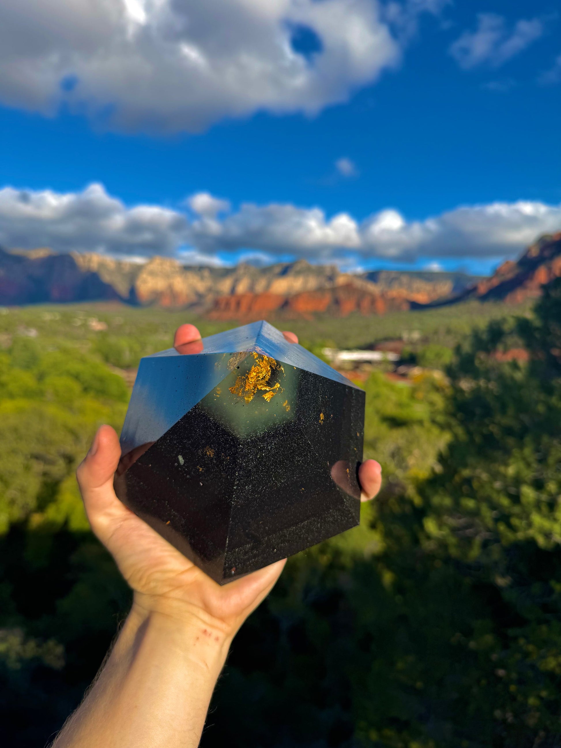 Green-glowing Black Sun Dodecahedron orgone pyramid, shown to scale
