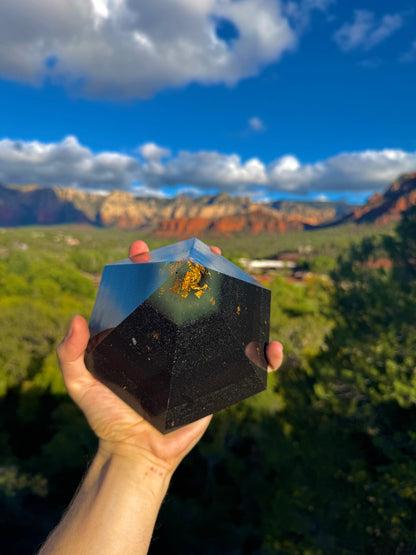 Green-glowing Black Sun Dodecahedron orgone pyramid, shown to scale