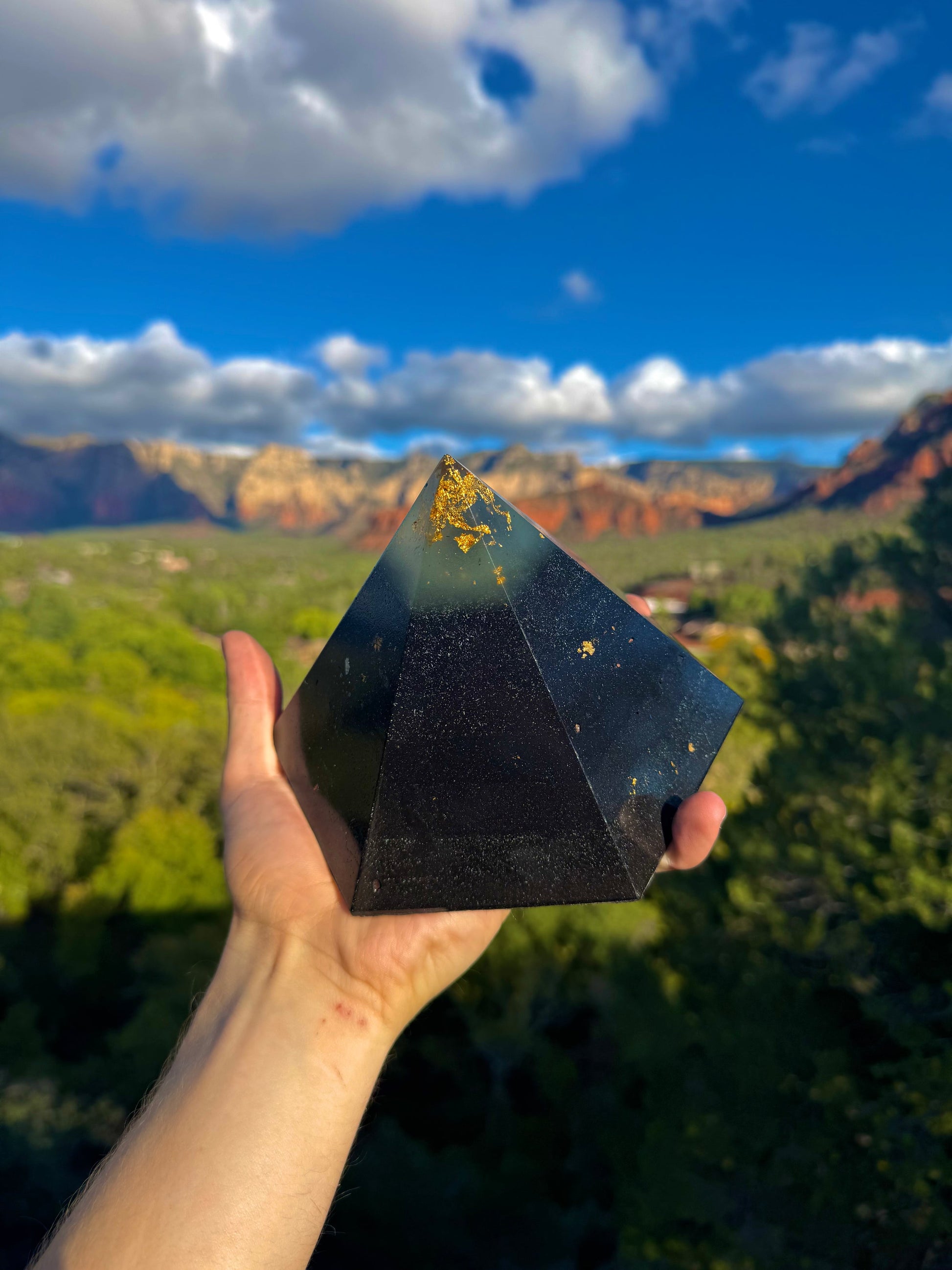 Green-glowing Black Sun Dodecahedron orgone pyramid, close-up view