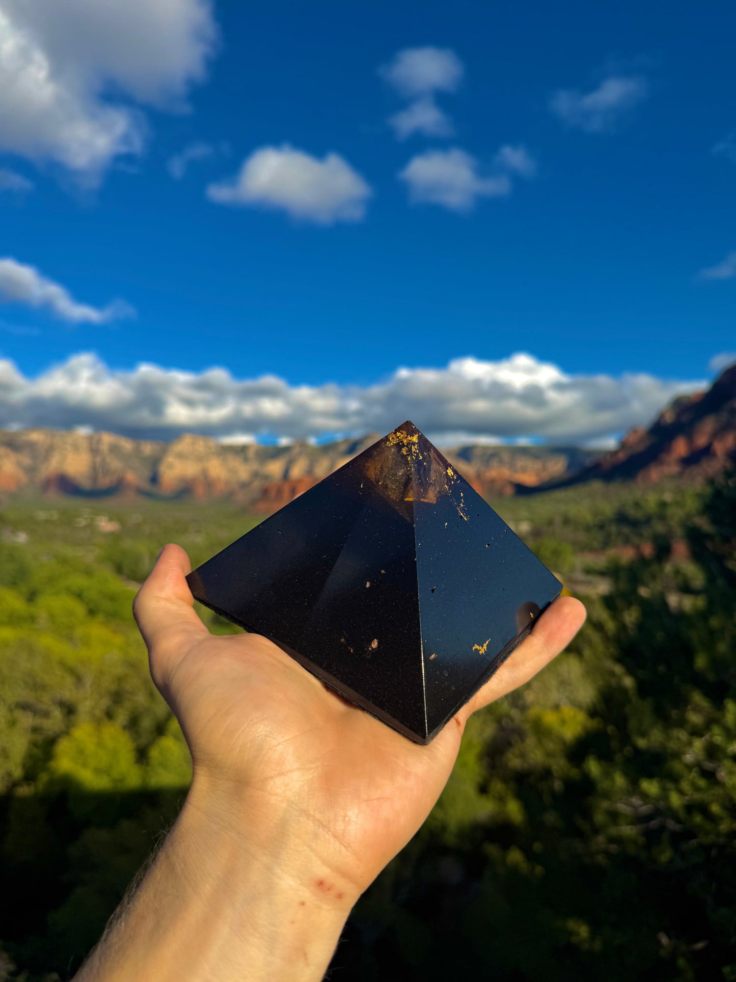 Custom red-toned Black Sun Giza orgone pyramid, close-up view