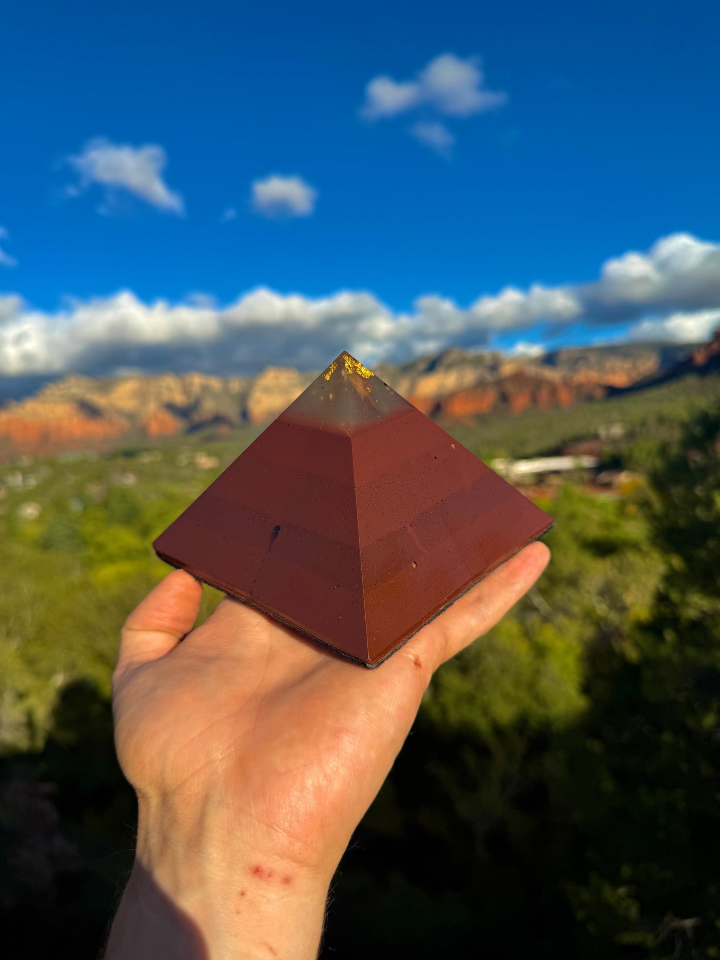Green-glowing Red Sun Giza orgone pyramid, glowing in the dark