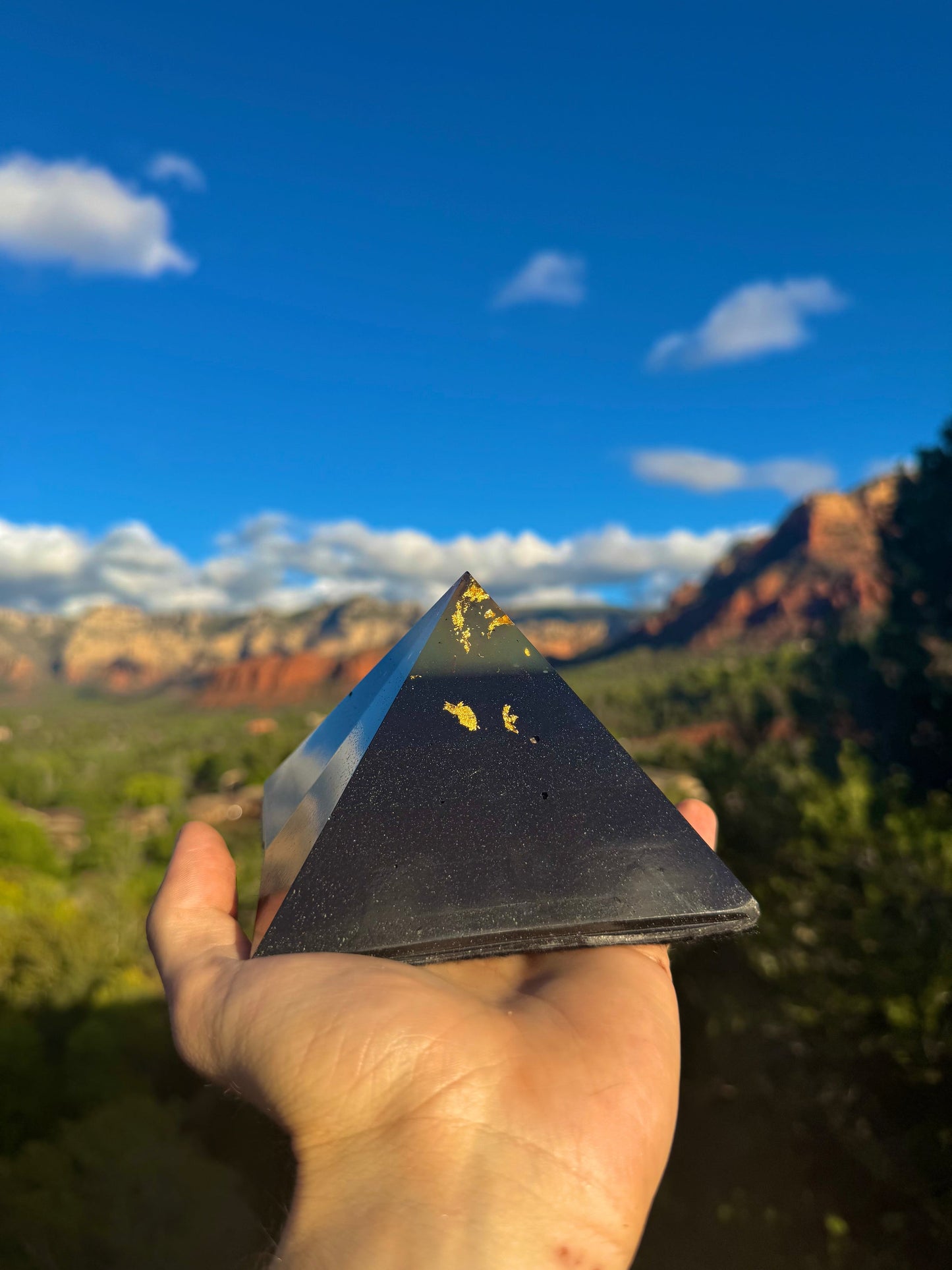Green-glowing Black Sun Giza orgone pyramid, glowing in the dark