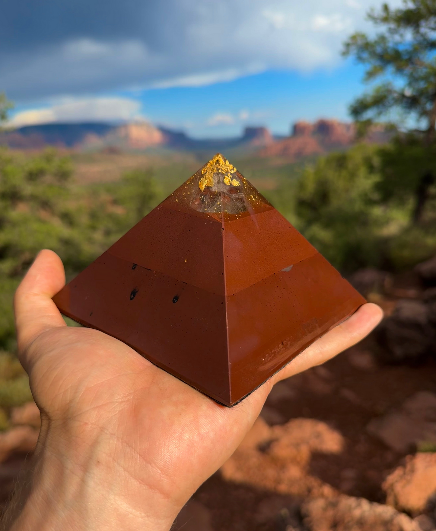 Medium Red Sun Giza orgone pyramid with a hematite and quartz base, handcrafted in Sedona
